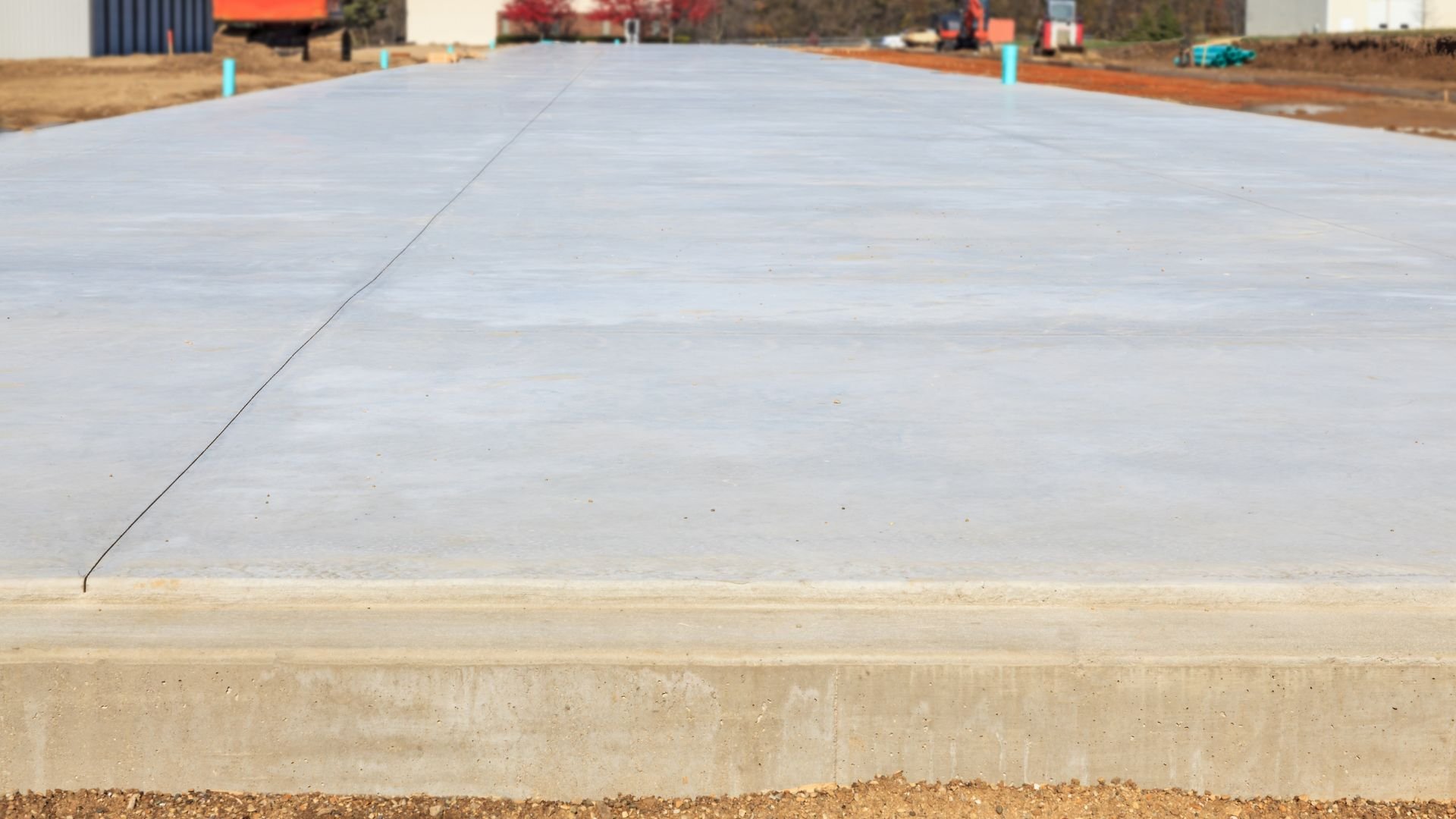 Freshly poured concrete slab with smooth surface at construction site